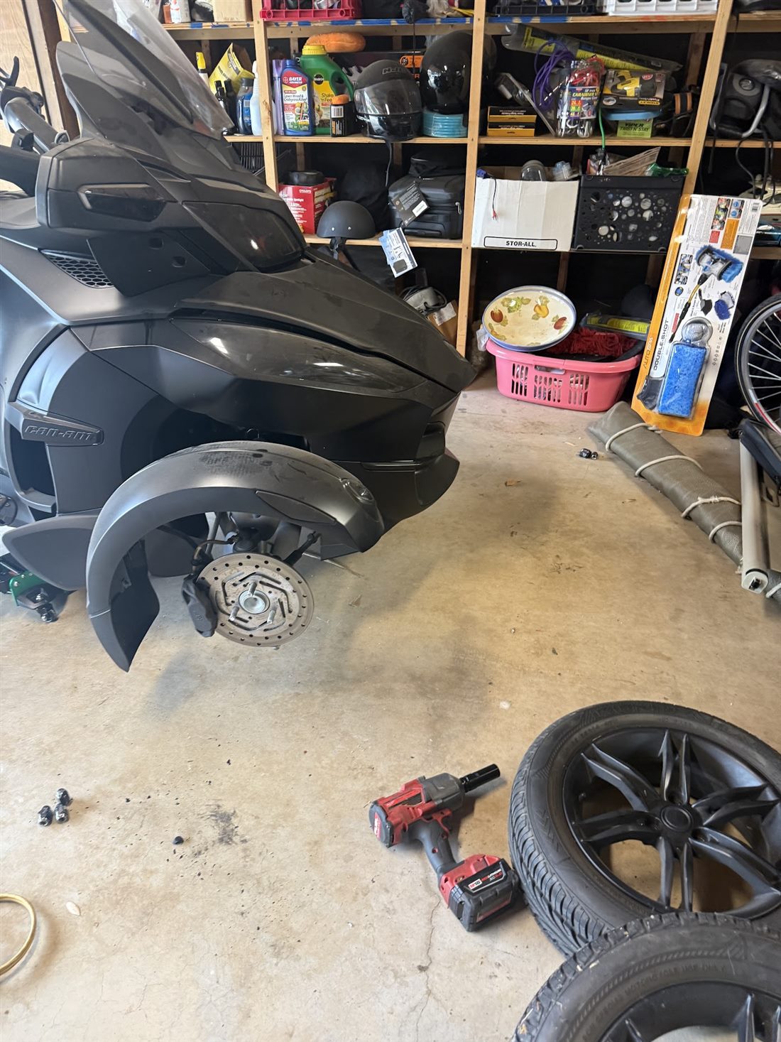 Can-Am Spyder RT with the front wheel off for brake and tire work